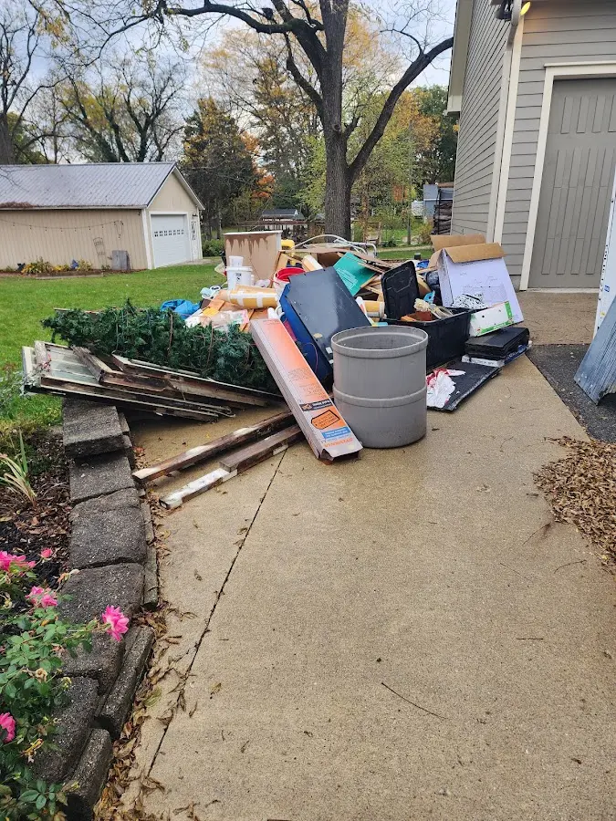 Dumpster being loaded with debris for Roofing Dumpster Rental in Kalifornsky
